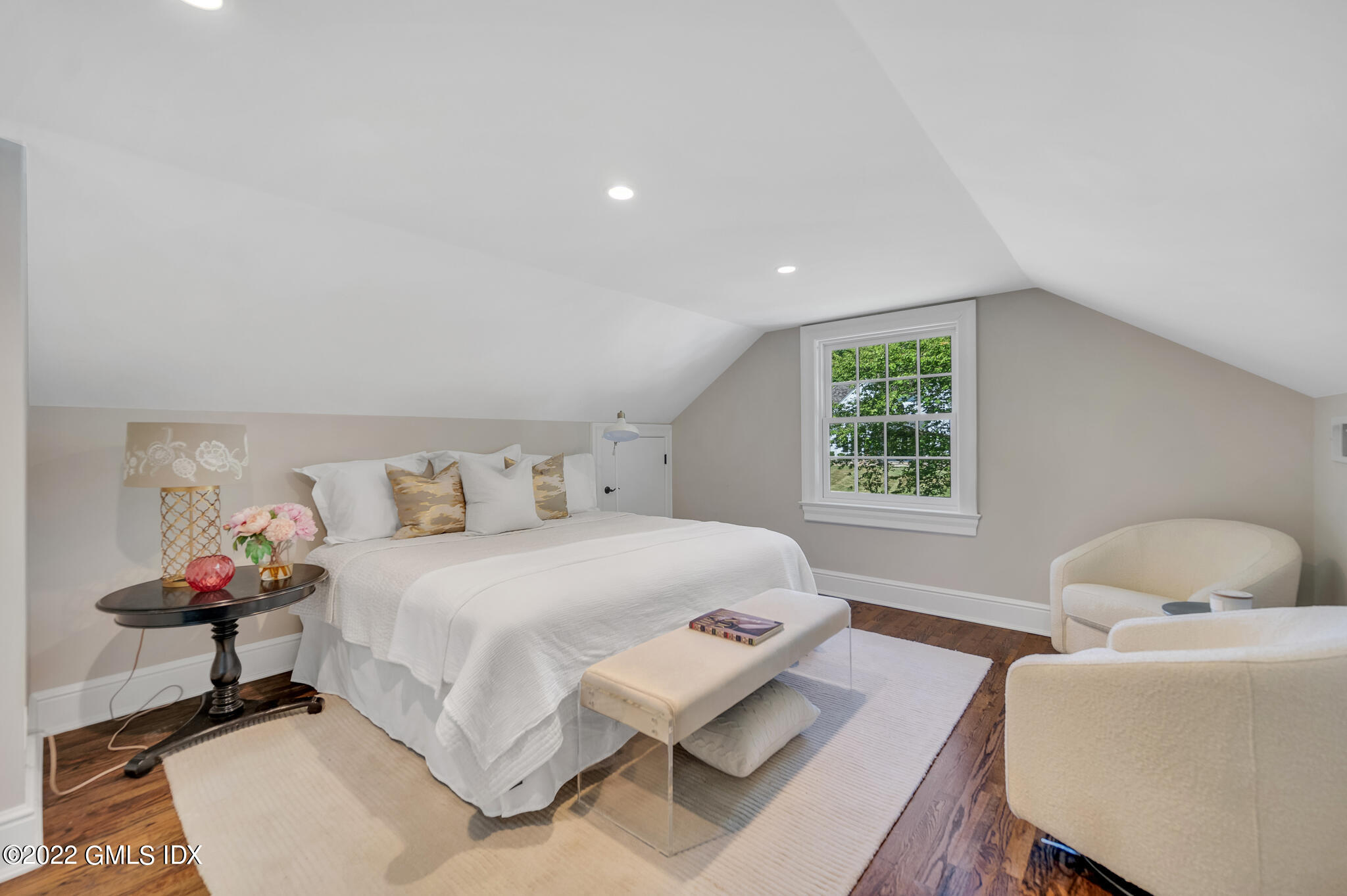 269 Riversville Road Greenwich, CT 06831 - Photo 51 of 55 a bedroom with a bed and a chandelier