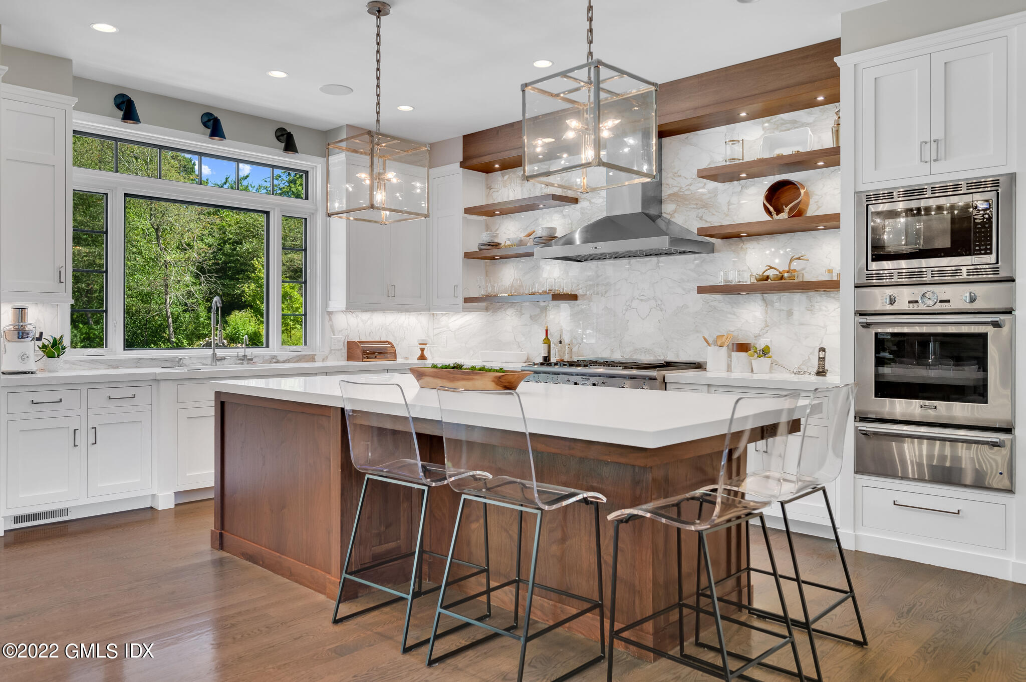 269 Riversville Road Greenwich, CT 06831 - Photo 9 of 55 a kitchen with a center island appliances and cabinets