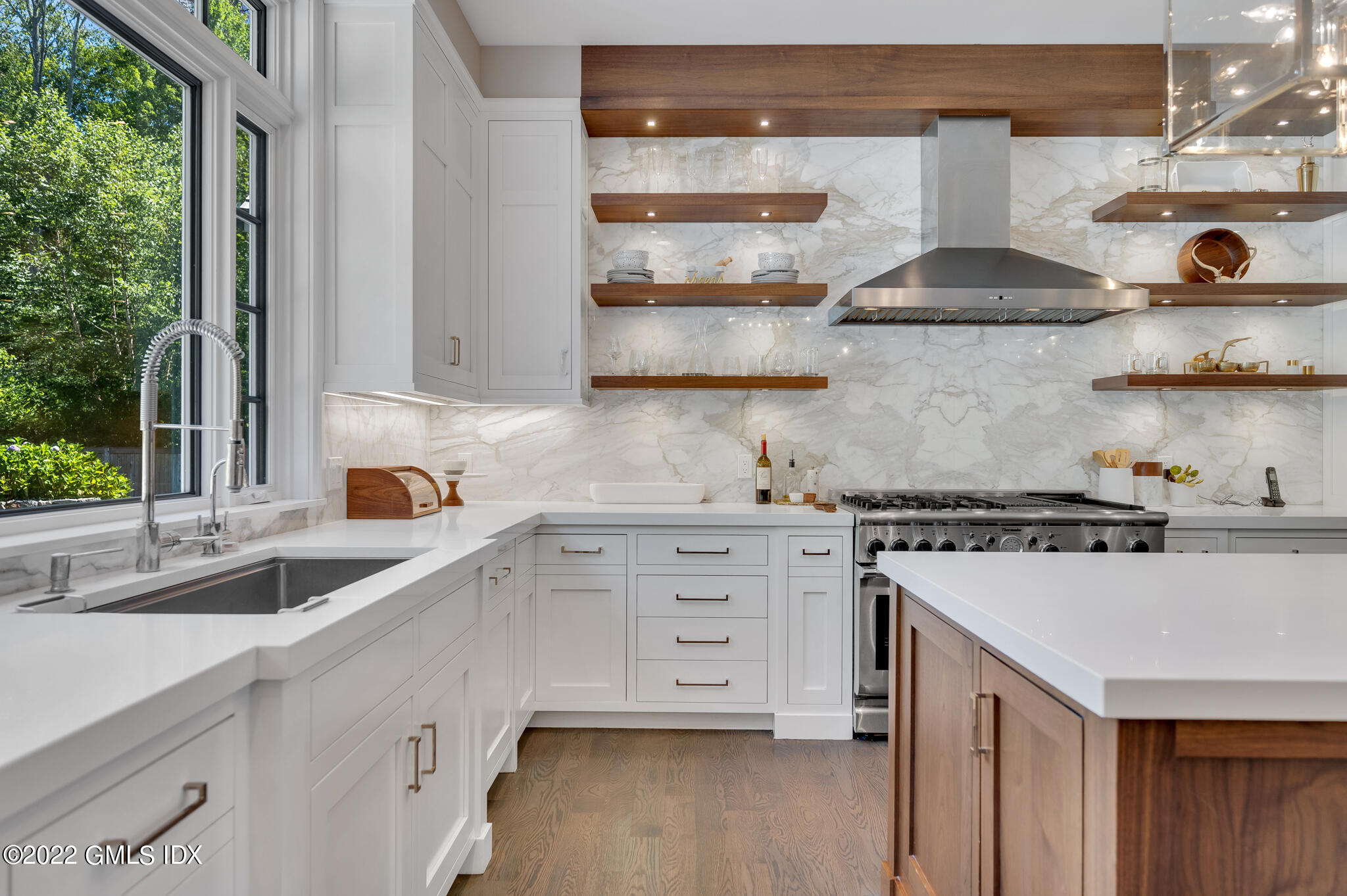 269 Riversville Road Greenwich, CT 06831 - Photo 10 of 55 a kitchen with stainless steel appliances a sink and cabinets