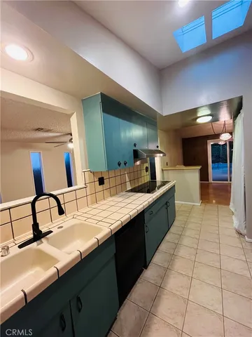 a large bathroom with a double vanity sink and a mirror