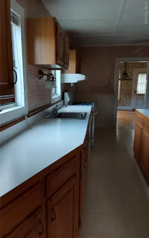 a dining room with furniture and a chandelier