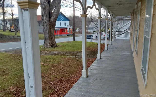 a view of wooden floor and closet area