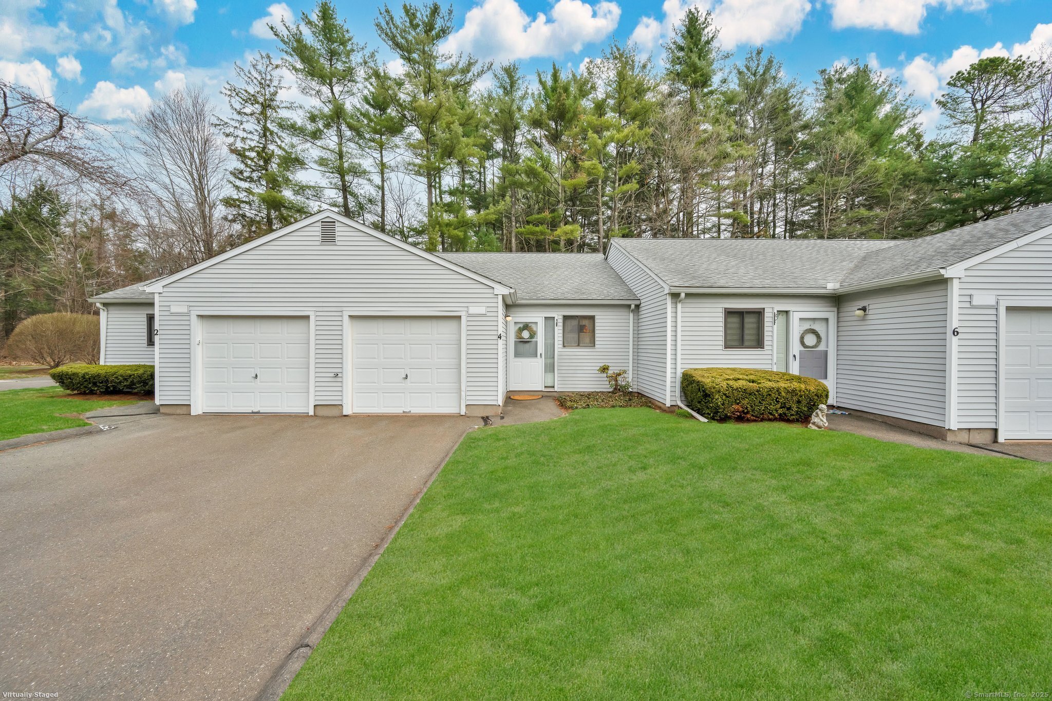 4 Knoll Lane, Unit 4 Simsbury, CT 06089 - Photo 1 of 1 a house view with a garden space