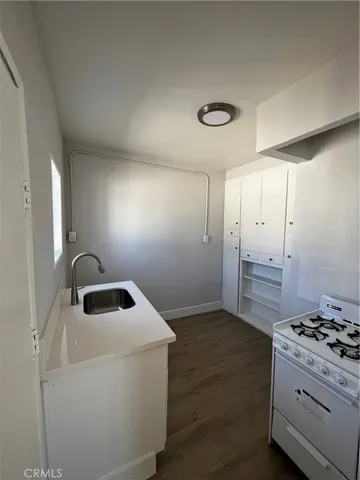a kitchen with a stove and a sink