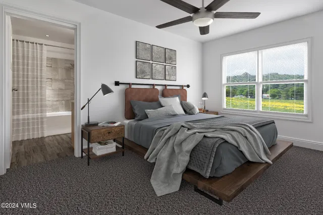 a bedroom with a bed and window