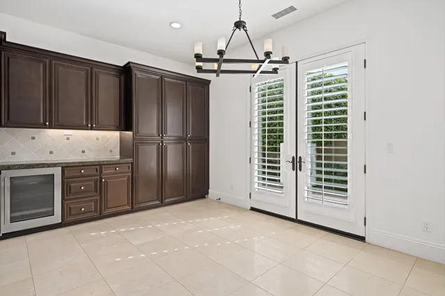 a kitchen with stainless steel appliances granite countertop a stove and a sink