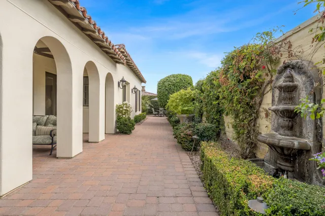 a view of a path along with potted plants