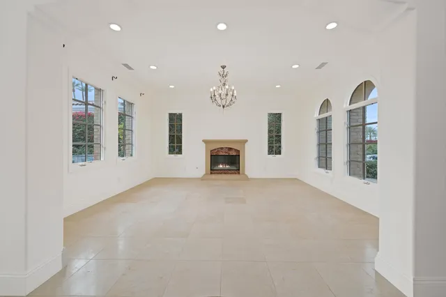 a view of a livingroom with wooden floor and entryway