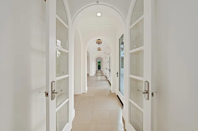 a view of an empty room with a fireplace and a window
