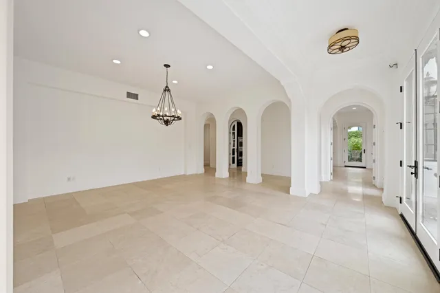 a view of a hallway with closet and wooden floor
