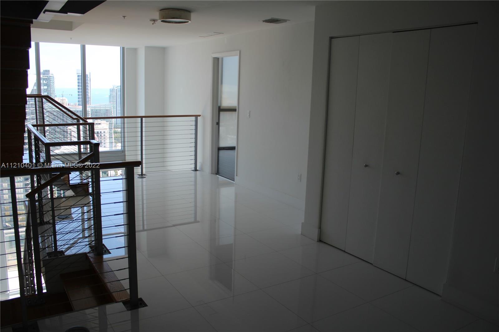 92 Southwest 3rd Street, Unit 5204 Miami, FL 33130 - Photo 8 of 20 a view of hallway with wooden floor