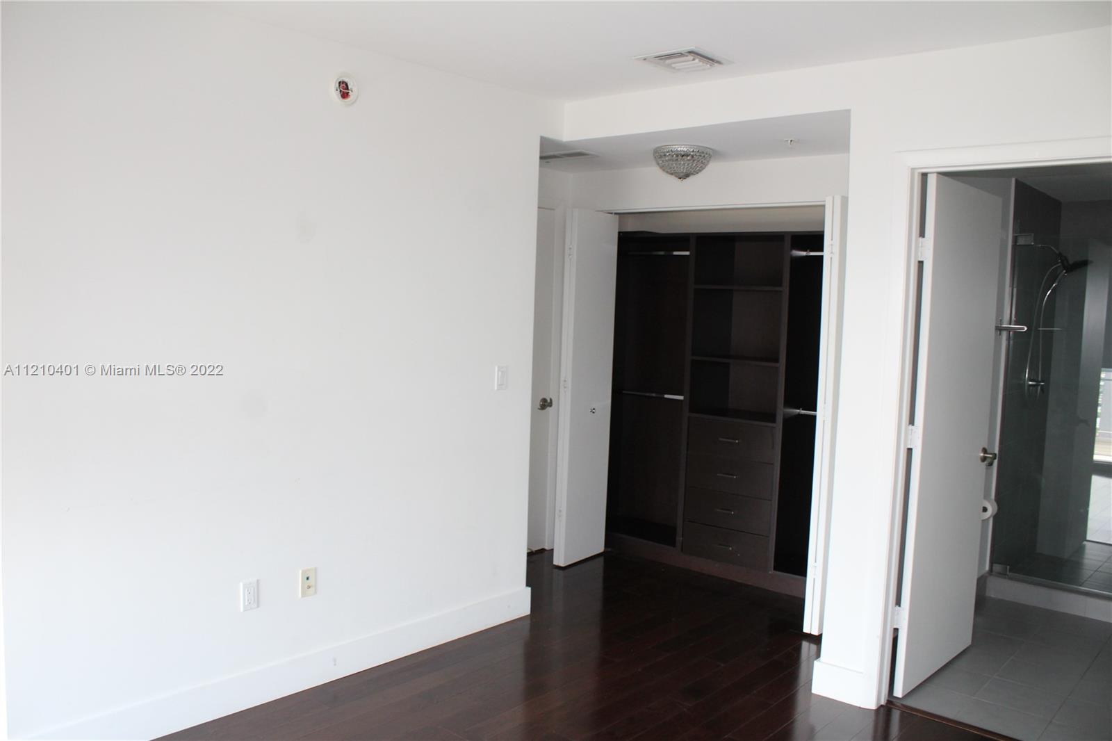 92 Southwest 3rd Street, Unit 5204 Miami, FL 33130 - Photo 10 of 20 a view of a hallway with wooden floor