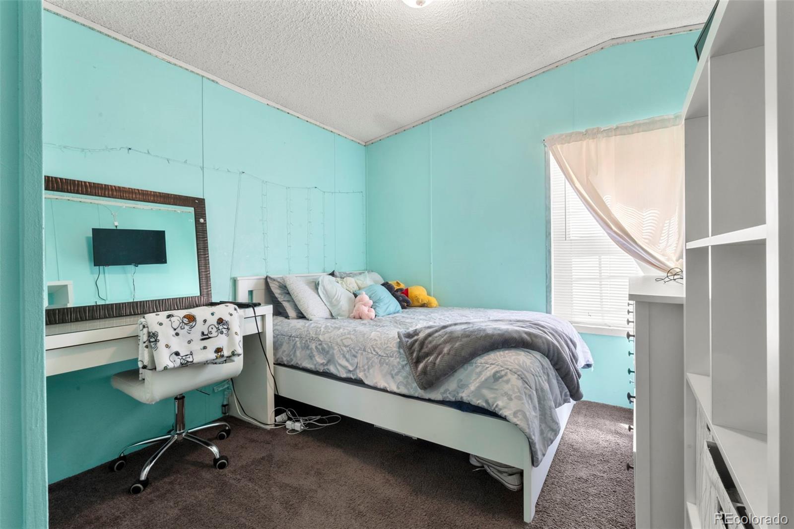 9850 Federal Boulevard Denver, CO 80260 - Photo 14 of 17 a bedroom with a bed wooden floor and window