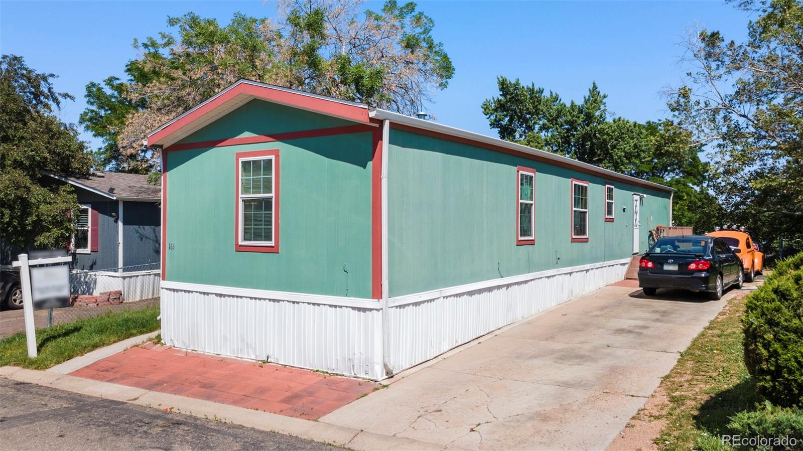 9850 Federal Boulevard Denver, CO 80260 - Photo 2 of 17 a view of a house with a yard