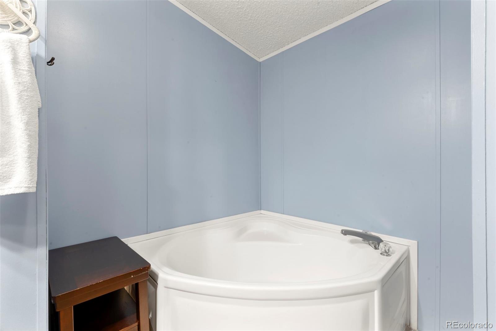 9850 Federal Boulevard Denver, CO 80260 - Photo 5 of 17 a bathroom with a sink and vanity