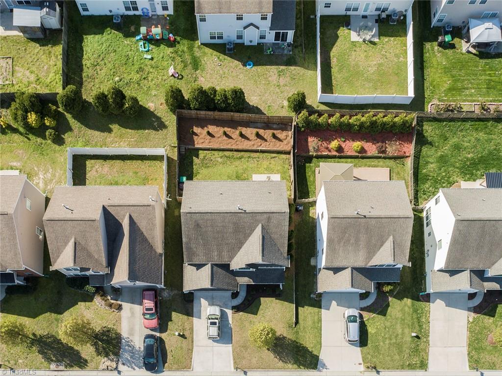 745 Spinning Wheel Point High Point, NC 27265 - Photo 2 of 34 Overhead view of the home showing the fully fenced backyard.