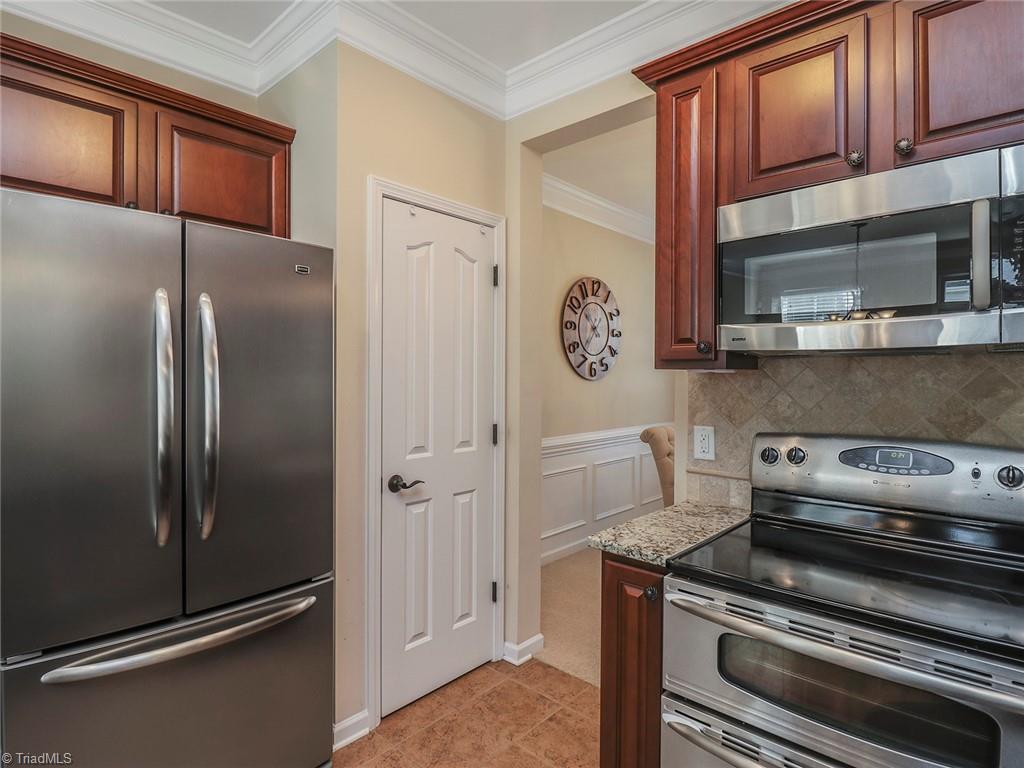 745 Spinning Wheel Point High Point, NC 27265 - Photo 11 of 34 The kitchen offers a pantry and all stainless steel appliances.