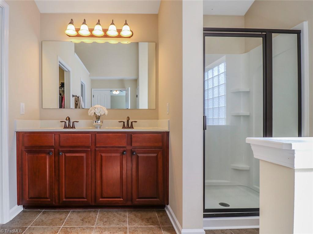 745 Spinning Wheel Point High Point, NC 27265 - Photo 18 of 34 Primary bath with double bowl vanity, stand alone shower and large closet.