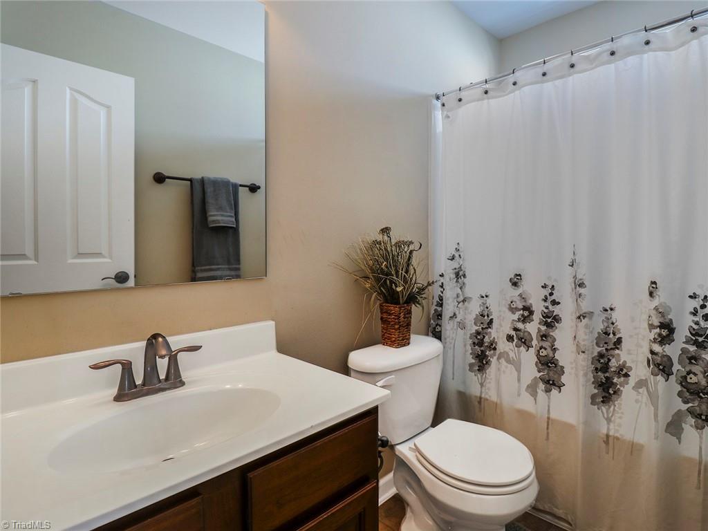 745 Spinning Wheel Point High Point, NC 27265 - Photo 22 of 34 Full hall bath upstairs with sower/tub combo.