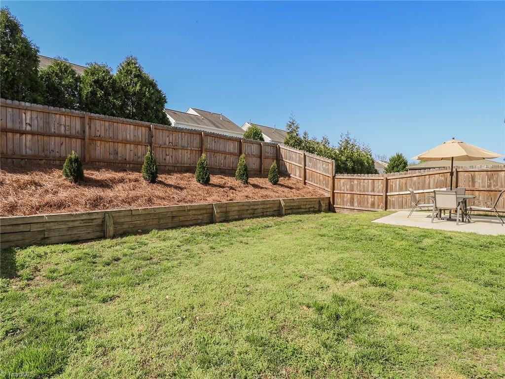 745 Spinning Wheel Point High Point, NC 27265 - Photo 30 of 34 View of the backyard looking towards the patio.