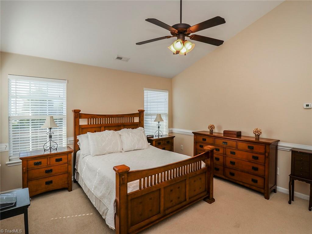 745 Spinning Wheel Point High Point, NC 27265 - Photo 6 of 34 Primary bedroom with vaulted ceilings.
