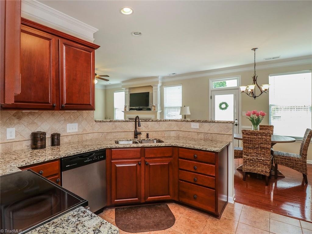 745 Spinning Wheel Point High Point, NC 27265 - Photo 9 of 34 Kitchen with granite counter tops and views of the breakfast room.