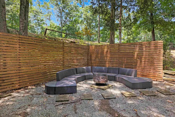 a backyard of a house with outdoor seating