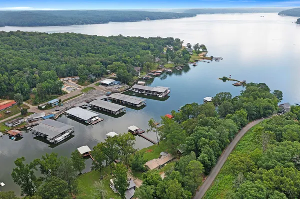 an aerial view of a house with lake view