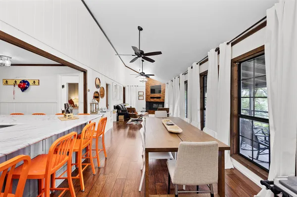 a view of a dining room with furniture window and wooden floor