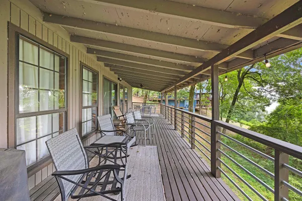 a view of a chairs and table in the balcony