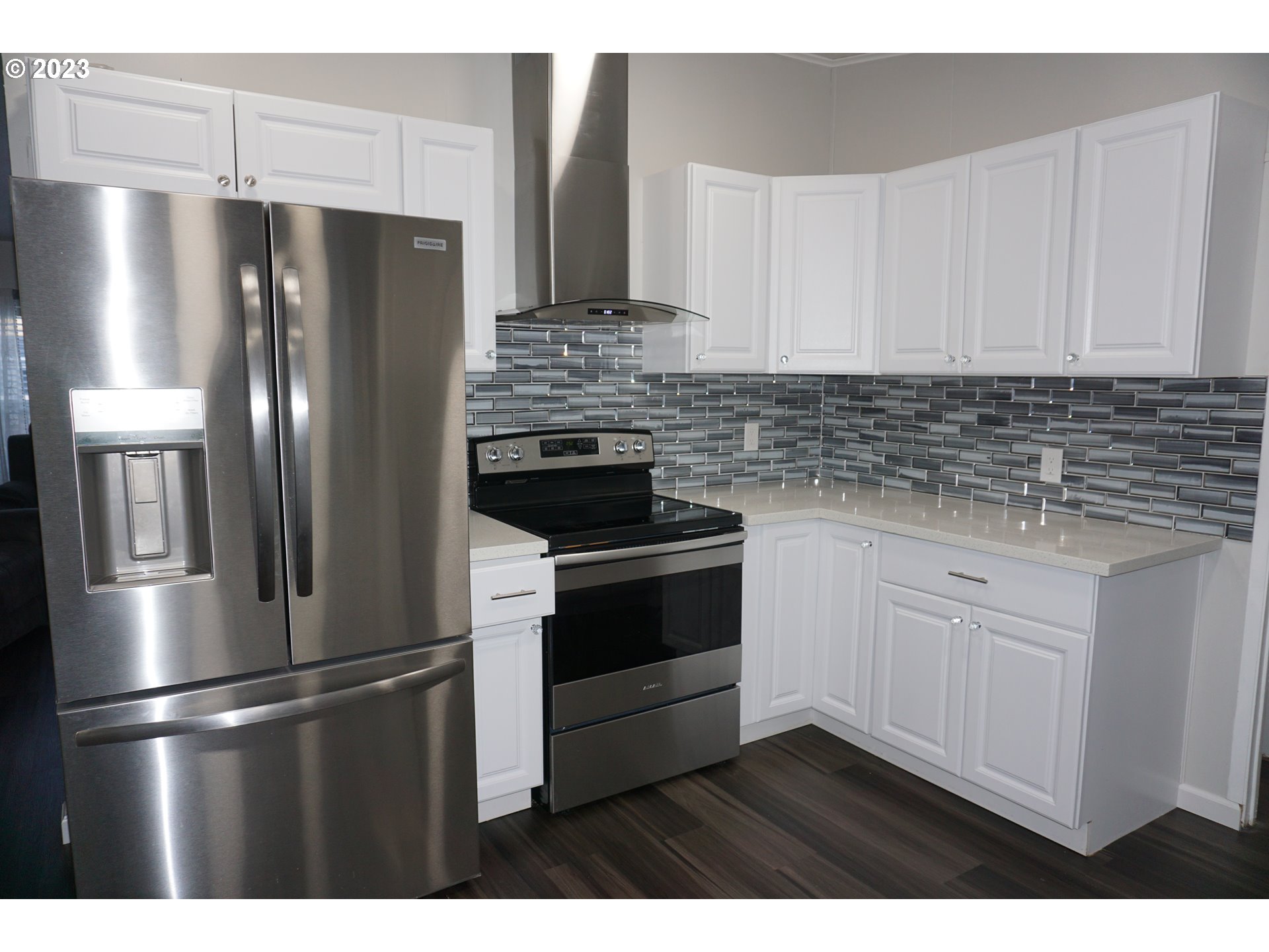 1949 Southeast Palmquist Road Gresham, OR 97080 - Photo 11 of 31 a kitchen with stainless steel appliances and refrigerator