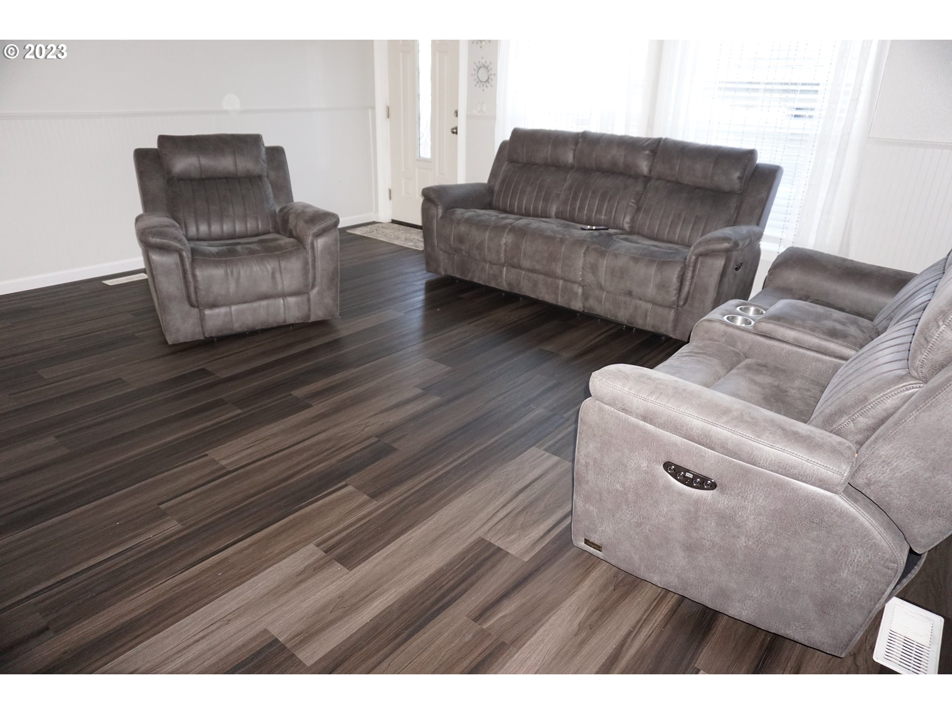 1949 Southeast Palmquist Road Gresham, OR 97080 - Photo 13 of 31 a living room with furniture and a wooden floor