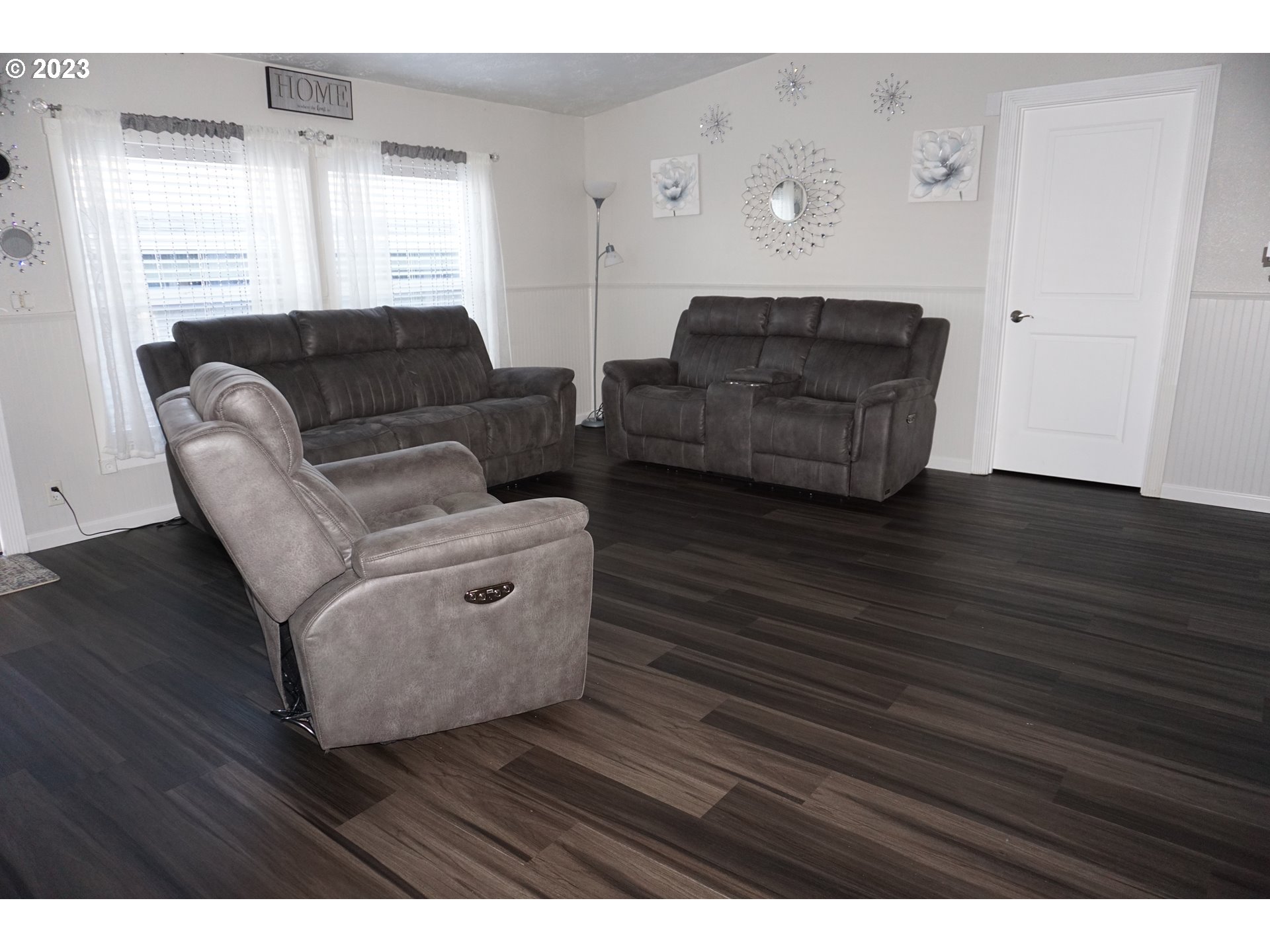 1949 Southeast Palmquist Road Gresham, OR 97080 - Photo 14 of 31 a living room with furniture and wooden floor