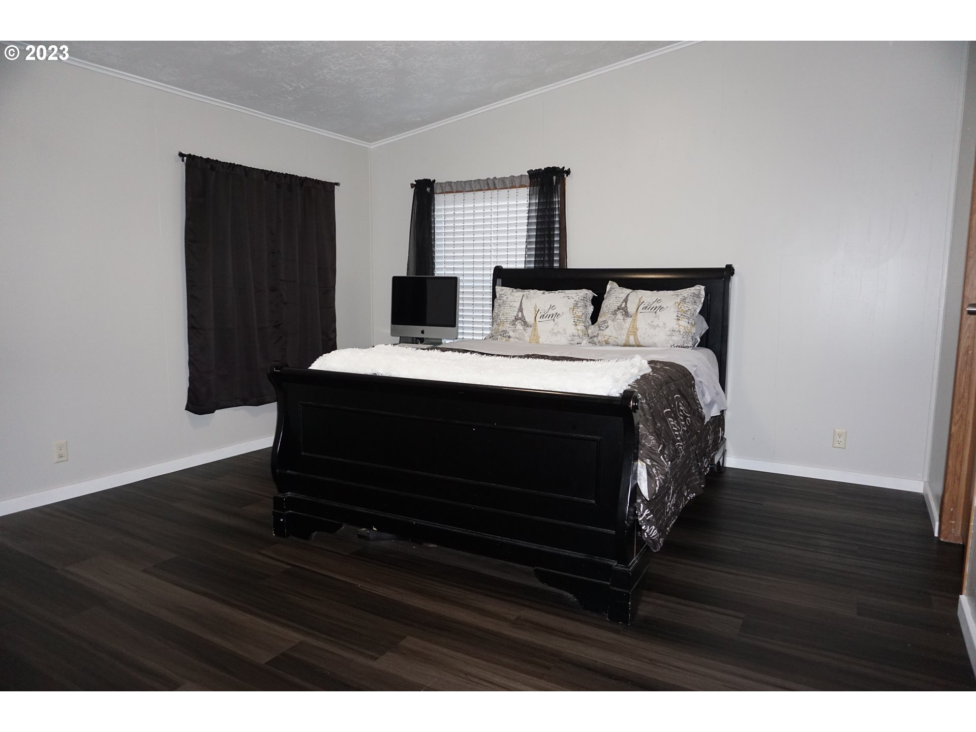 1949 Southeast Palmquist Road Gresham, OR 97080 - Photo 16 of 31 a bedroom with a bed window and a night stand