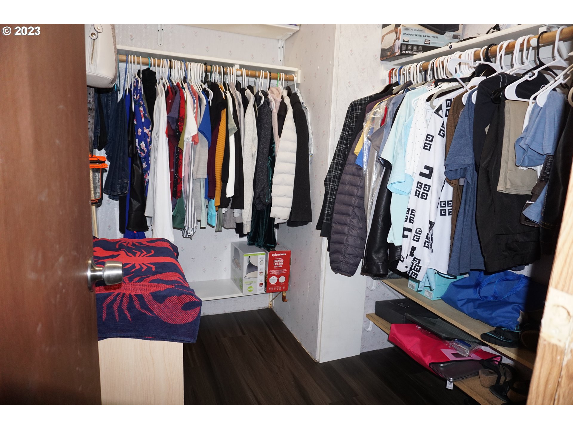 1949 Southeast Palmquist Road Gresham, OR 97080 - Photo 18 of 31 a view of walk in closet with clothes