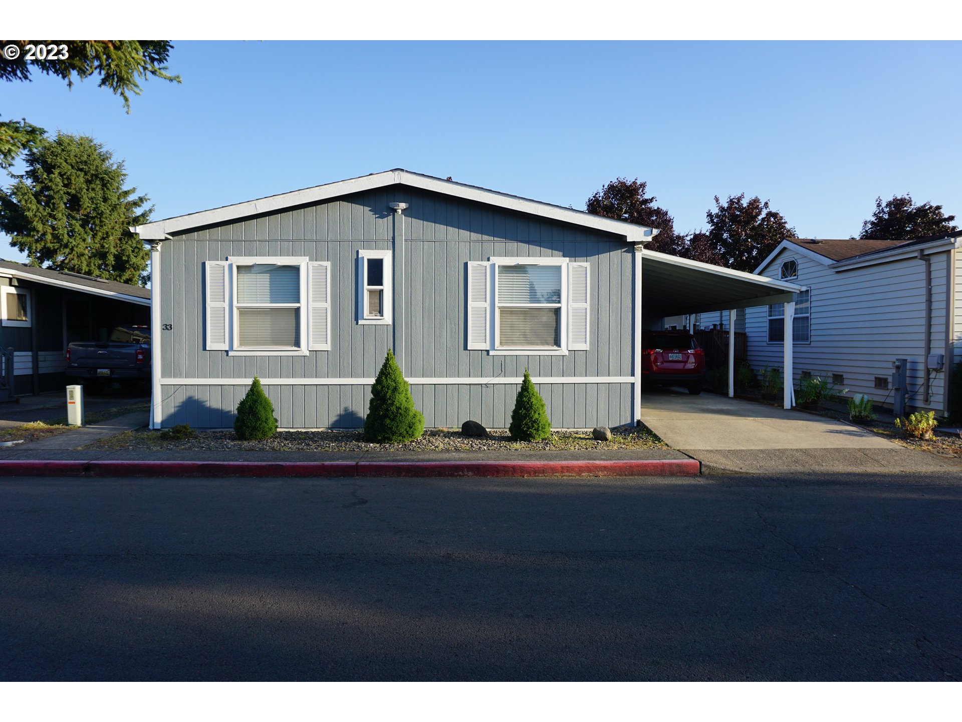 1949 Southeast Palmquist Road Gresham, OR 97080 - Photo 2 of 31 a front view of a house with a yard