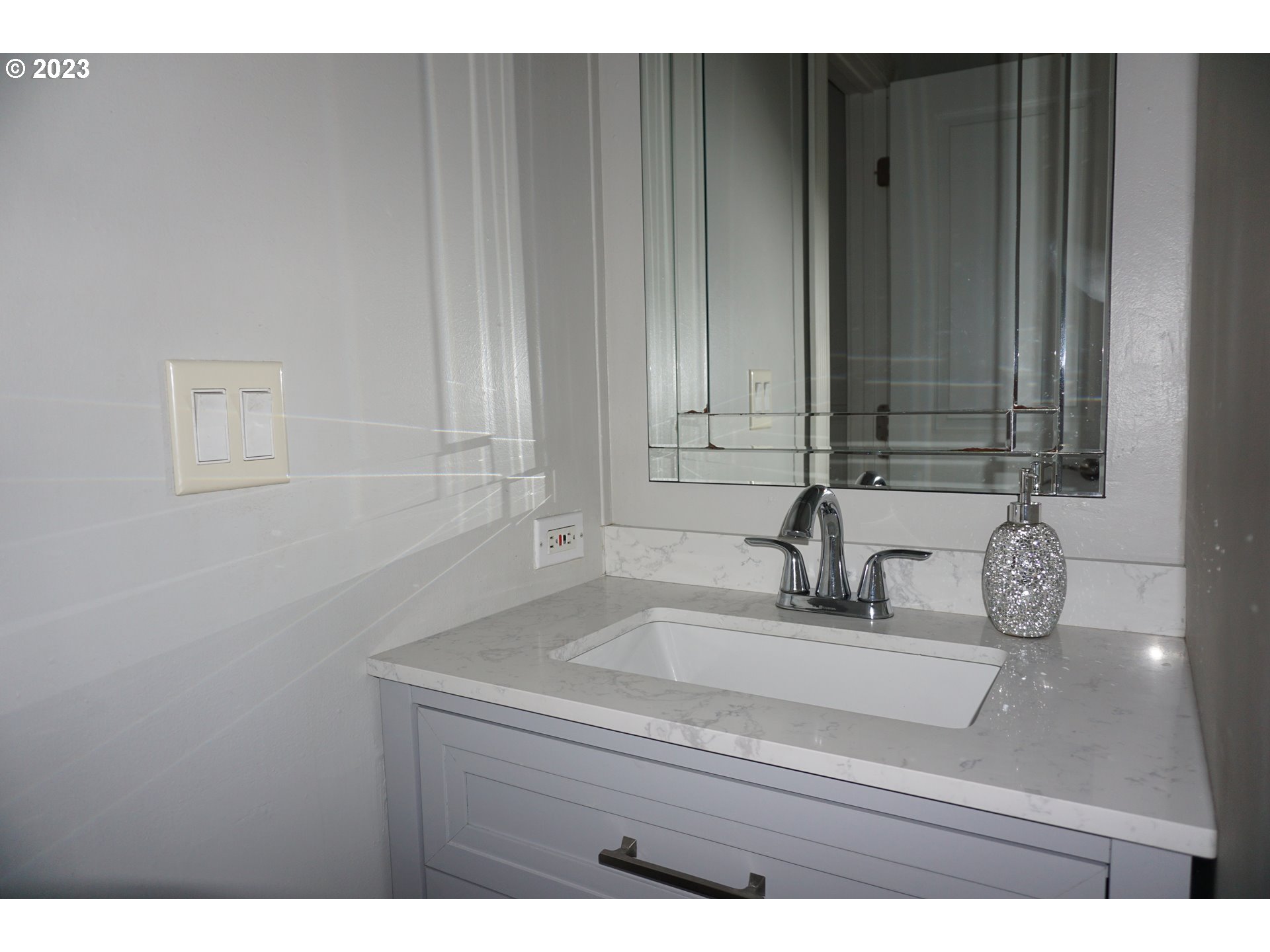 1949 Southeast Palmquist Road Gresham, OR 97080 - Photo 24 of 31 a bathroom with a sink and vanity