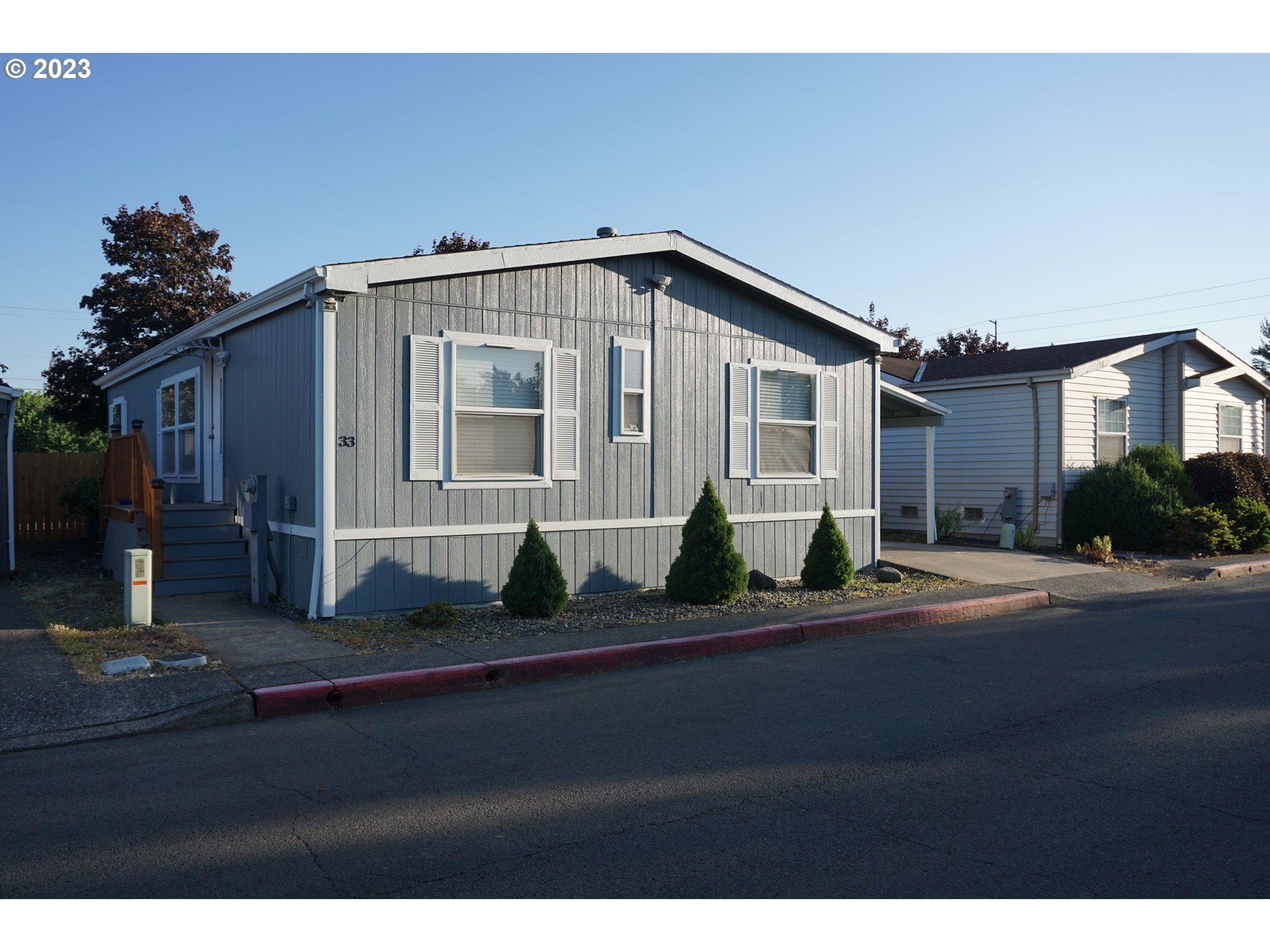 1949 Southeast Palmquist Road Gresham, OR 97080 - Photo 3 of 31 a front view of a house with a yard