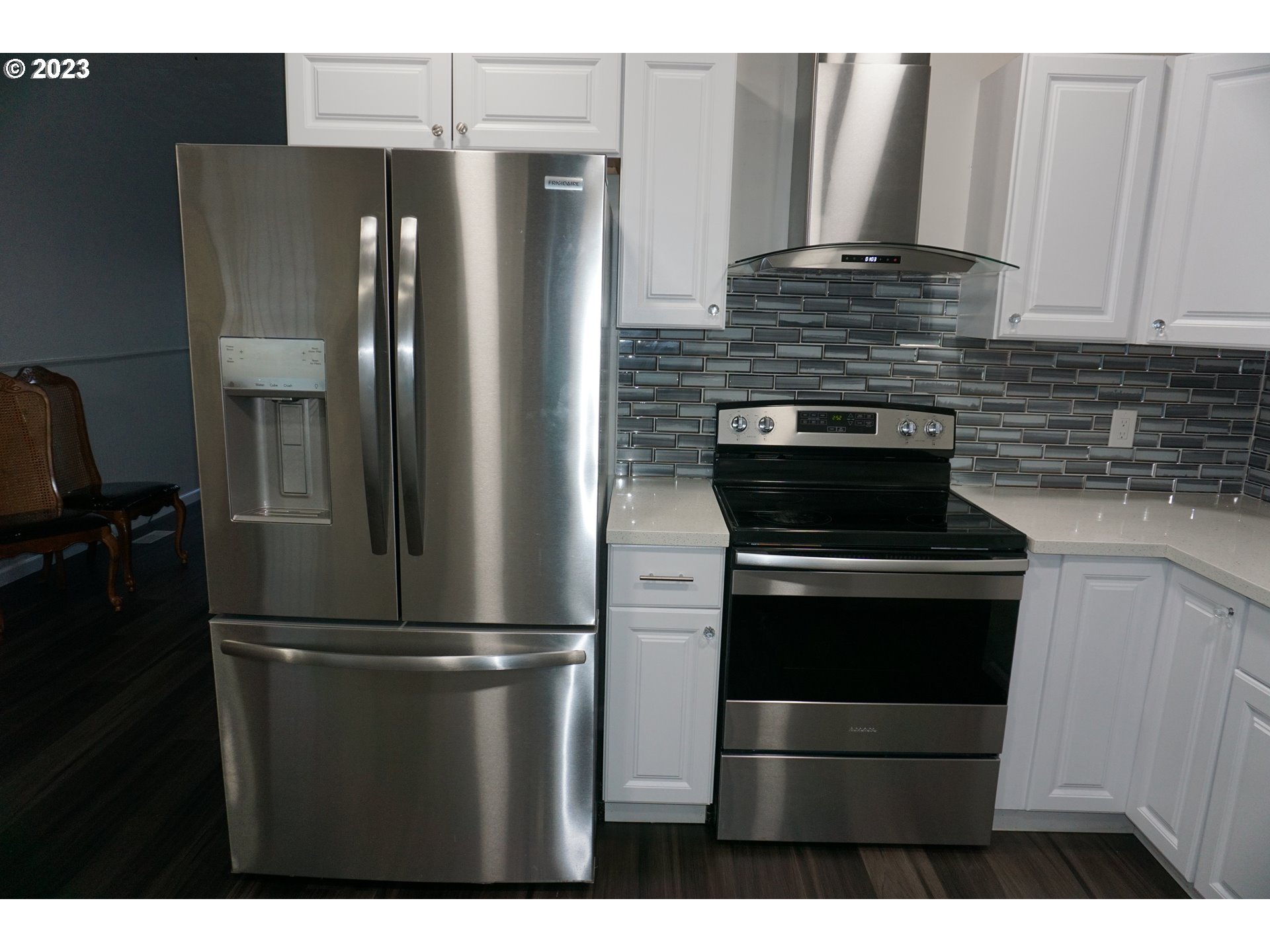 1949 Southeast Palmquist Road Gresham, OR 97080 - Photo 10 of 31 a kitchen with stainless steel appliances granite countertop a refrigerator and a stove