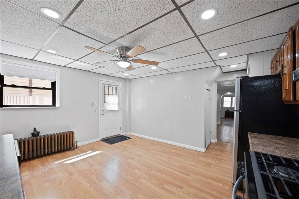 137 South 12th Street Pittsburgh, PA 15203 - Photo 11 of 24 a bedroom with a bed and wooden floor