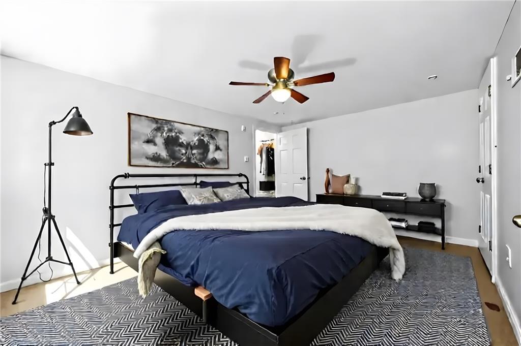 137 South 12th Street Pittsburgh, PA 15203 - Photo 14 of 24 a bedroom with bed and a chandelier