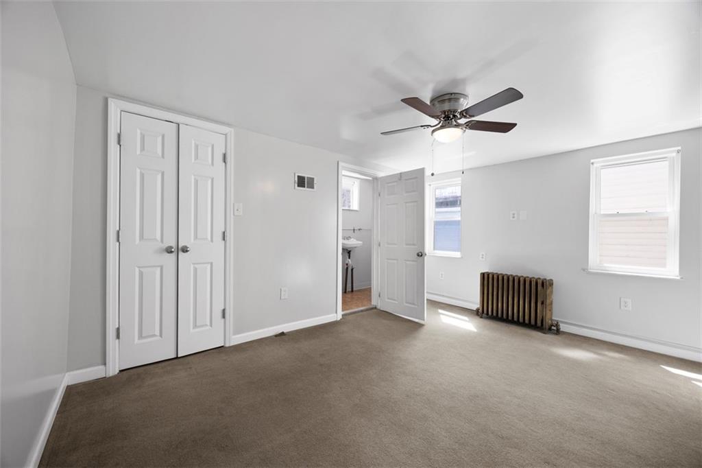 137 South 12th Street Pittsburgh, PA 15203 - Photo 15 of 24 an empty room with windows and fan