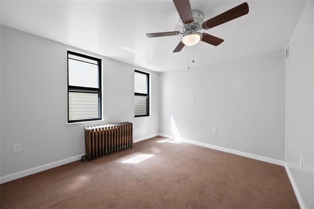 137 South 12th Street Pittsburgh, PA 15203 - Photo 18 of 24 an empty room with windows and ceiling fan