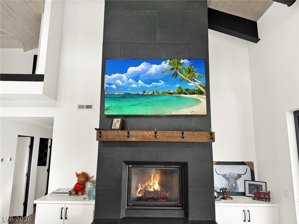 9393 North 93rd Highway Caliente, NV 89008 - Photo 24 of 41 A grand, tall fireplace with an eye-level hearth creates an inviting focal point in this room.