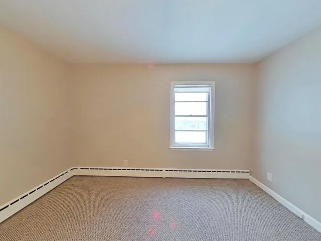 a view of a room that has a window in it