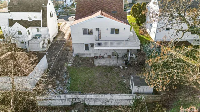 a aerial view of a house with a yard
