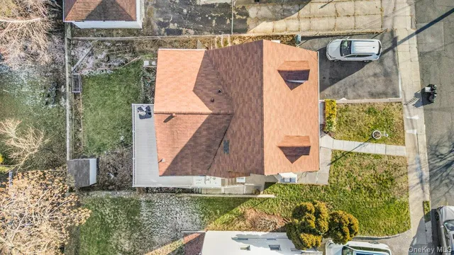 an aerial view of a house with a swimming pool