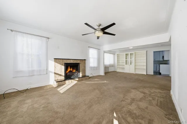 a big room with closet and a fireplace
