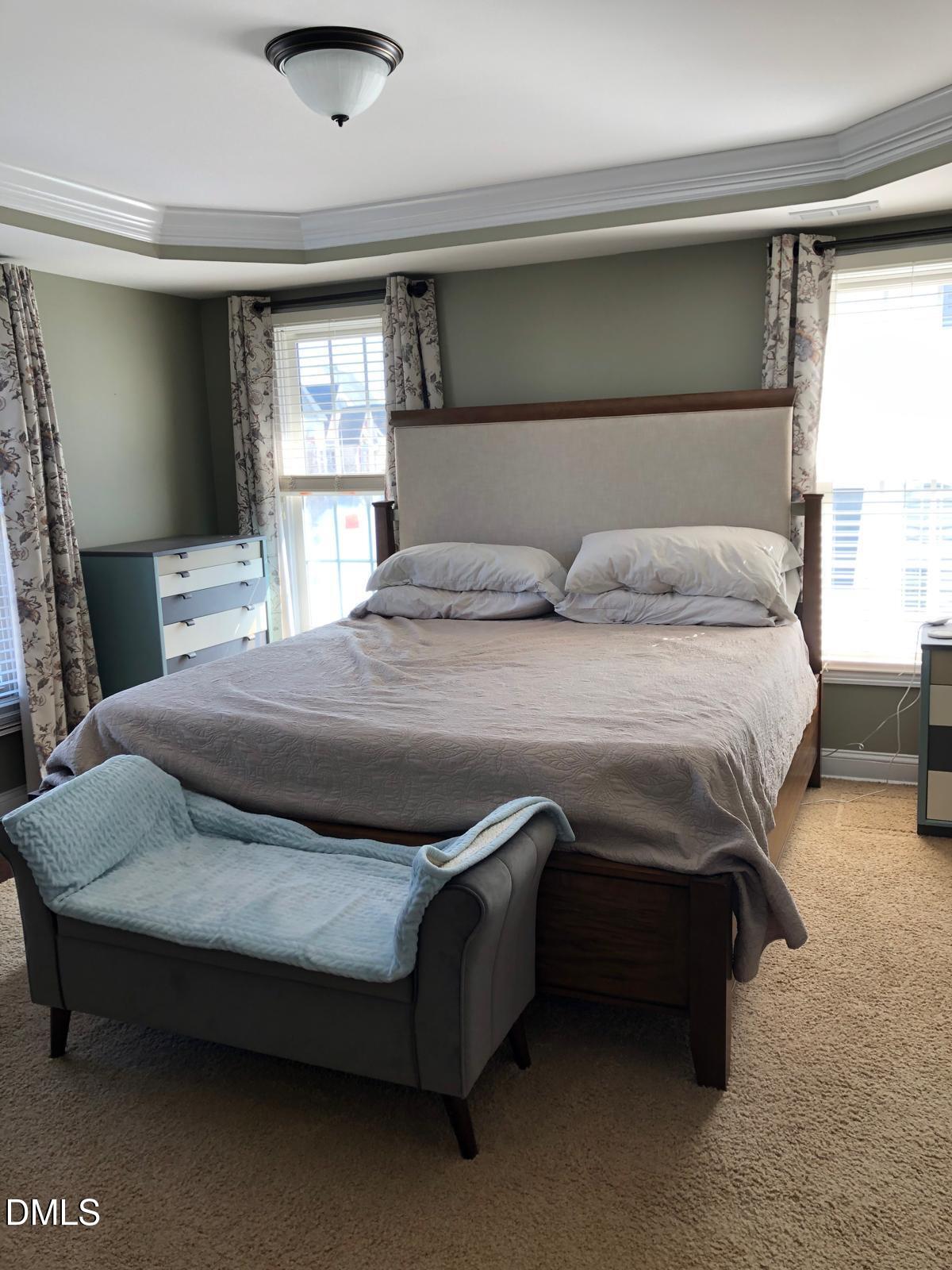 133 Fort Jackson Road Morrisville, NC 27560 - Photo 14 of 25 a bedroom with a bed and a window