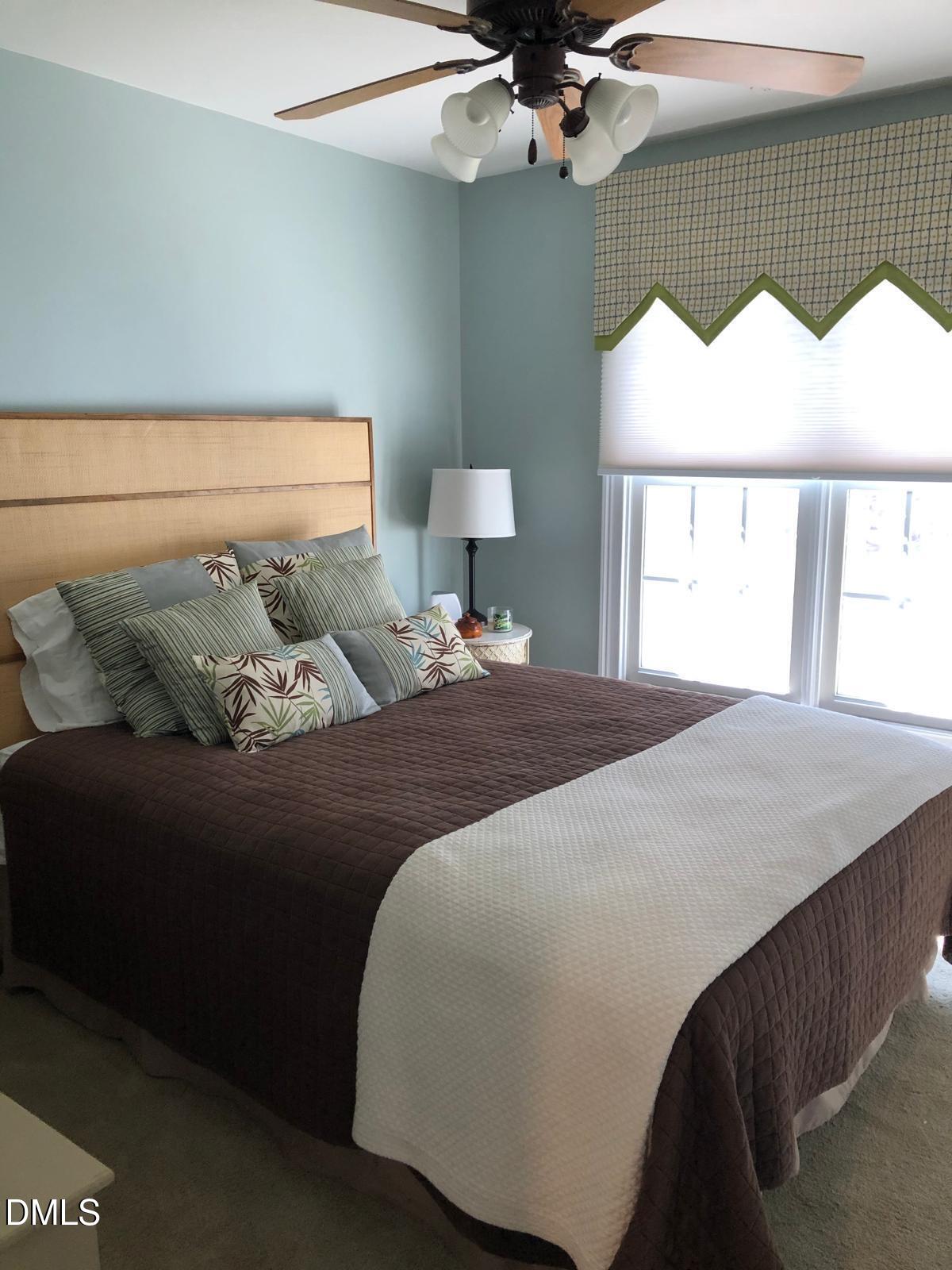 133 Fort Jackson Road Morrisville, NC 27560 - Photo 18 of 25 a bedroom with a bed and window